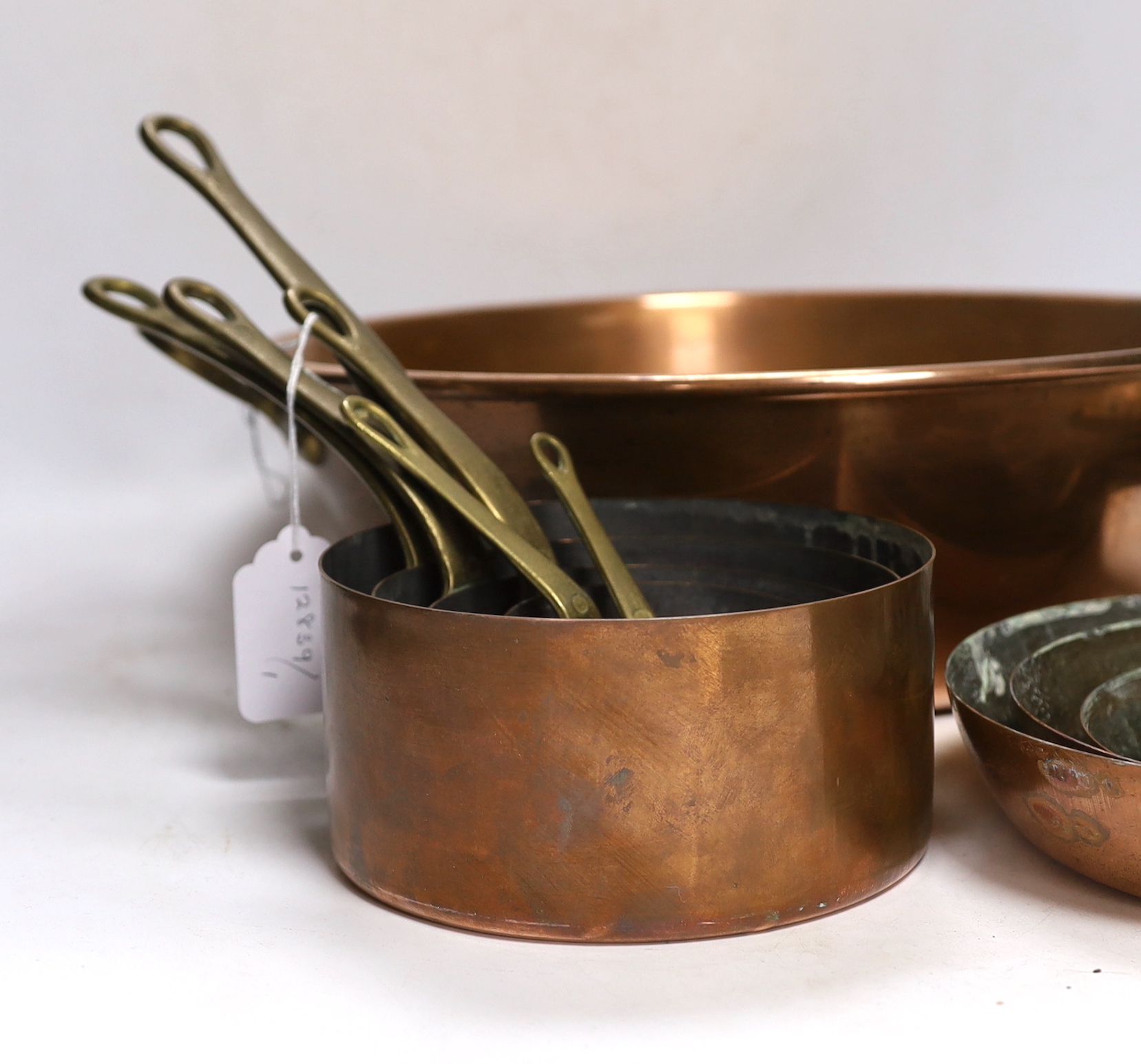 A set of 6 graduated saucepans and a similar and a 2 handled preserve pan, 45cm